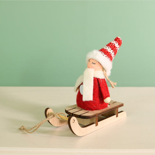 Festive Aurora Doll On A Toboggan