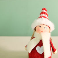 Festive Aurora Doll On A Toboggan